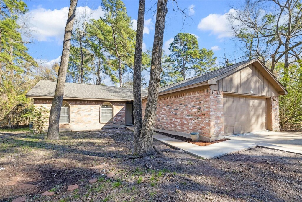 view of property exterior with a garage