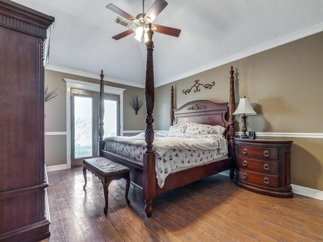 bedroom with vaulted ceiling, ceiling fan, ornamental molding, and hardwood / wood-style floors