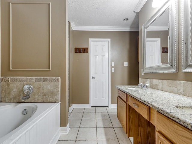 bathroom featuring a textured ceiling, ornamental molding, vanity, a tub, and tile patterned flooring