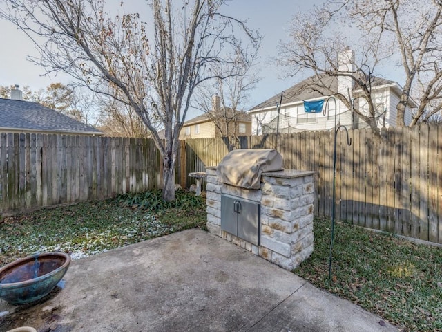 view of patio featuring a grill and exterior kitchen