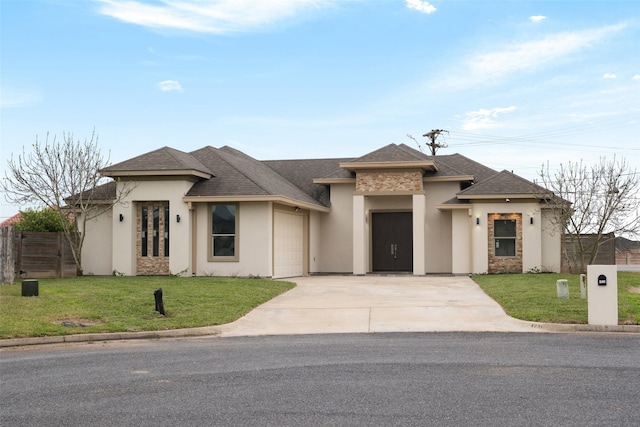 view of front of home with a garage and a front yard