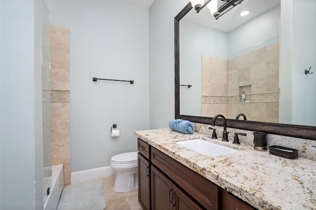 bathroom with vanity, tile patterned flooring, and toilet