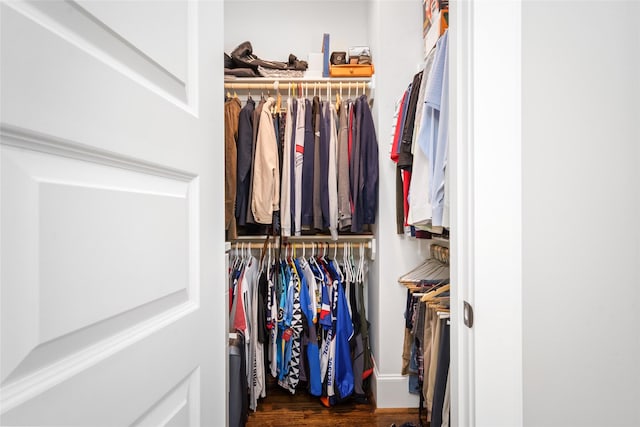 walk in closet featuring dark hardwood / wood-style flooring