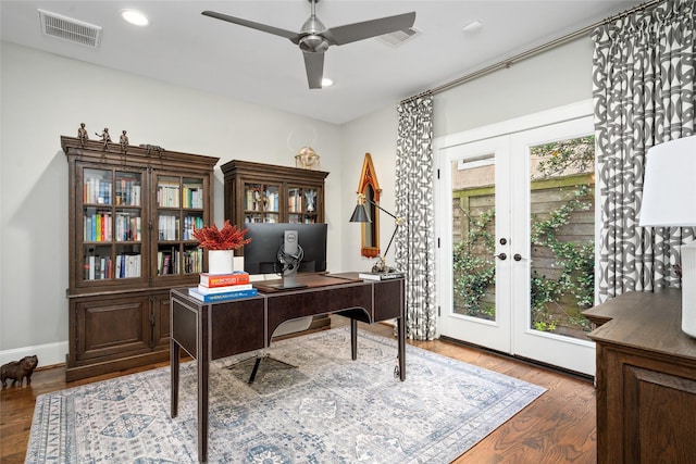 office space featuring dark wood-type flooring, french doors, and ceiling fan