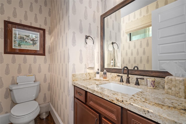 bathroom with vanity and toilet