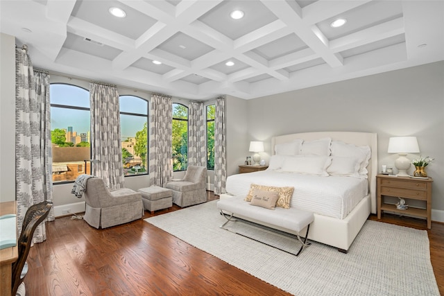 bedroom featuring hardwood / wood-style flooring, coffered ceiling, and beamed ceiling