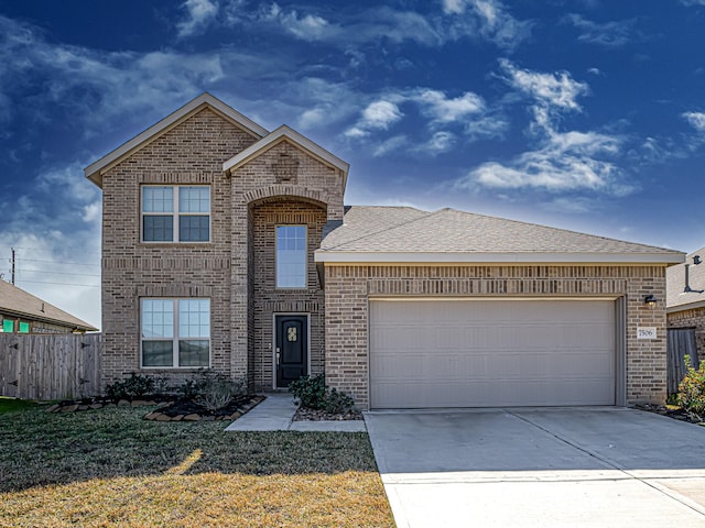 front facade with a garage and a front lawn