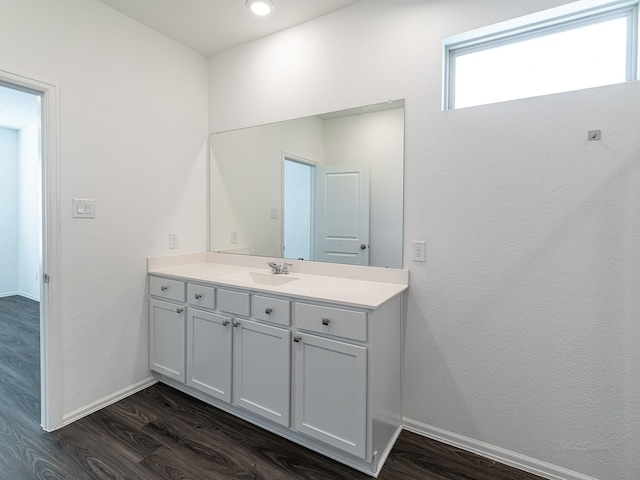 bathroom featuring vanity and hardwood / wood-style floors