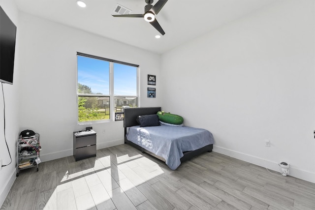 bedroom featuring ceiling fan and light hardwood / wood-style flooring