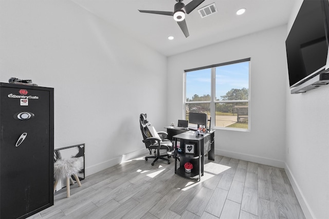 office space with light hardwood / wood-style flooring and ceiling fan