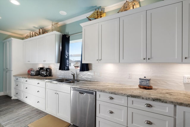 kitchen featuring sink, light stone counters, stainless steel dishwasher, ornamental molding, and white cabinets