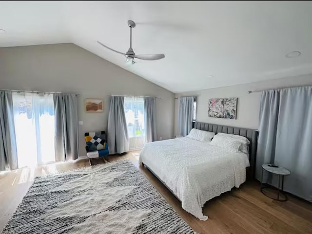 bedroom featuring lofted ceiling, dark hardwood / wood-style floors, and ceiling fan