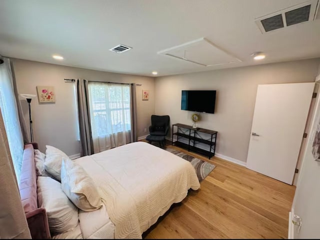 bedroom with light wood-type flooring