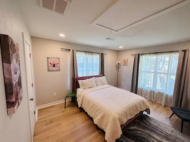 bedroom with light hardwood / wood-style floors