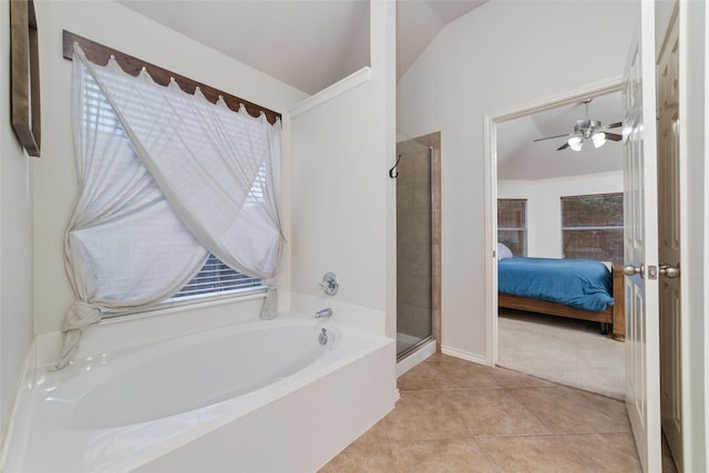 bathroom with ceiling fan, lofted ceiling, tile patterned floors, and separate shower and tub