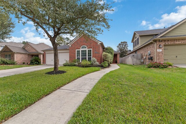 view of front of property with a garage and a front yard