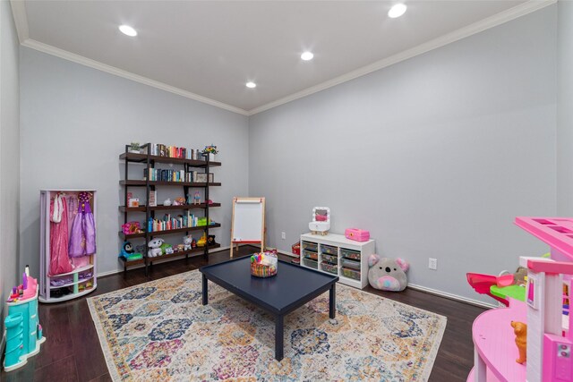 playroom featuring dark hardwood / wood-style flooring and crown molding