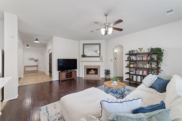 living room with hardwood / wood-style flooring and ceiling fan