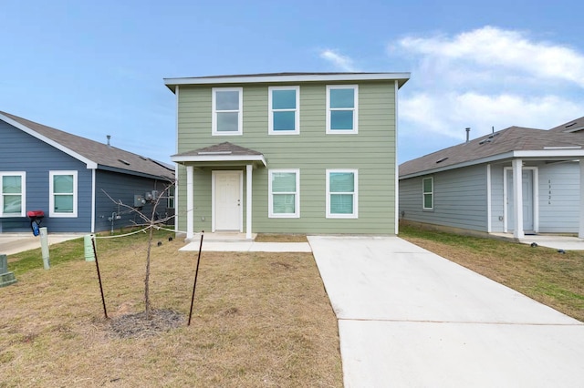 view of property featuring a front lawn