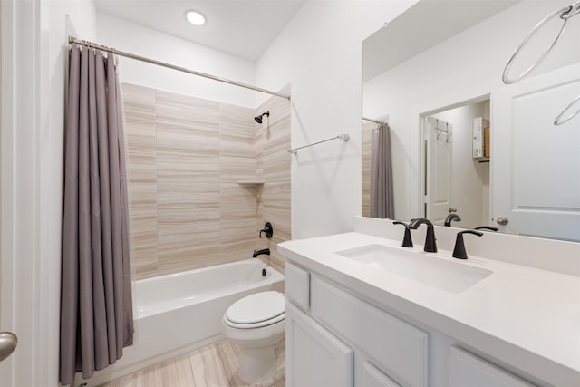 bathroom with shower / tub combo, vanity, and toilet