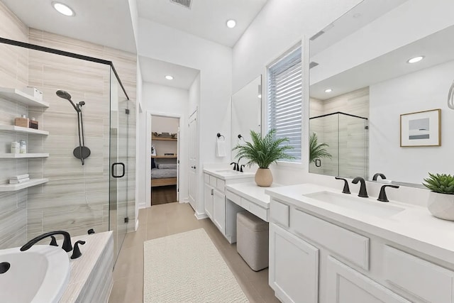 bathroom featuring a garden tub, recessed lighting, visible vents, vanity, and a stall shower