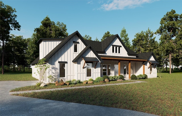 modern farmhouse style home featuring a front lawn and a porch