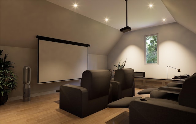 home theater with lofted ceiling and light wood-type flooring