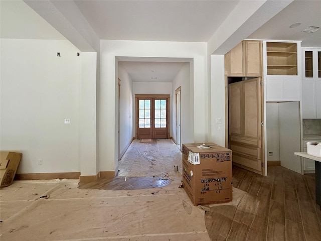 mudroom featuring hardwood / wood-style floors and french doors