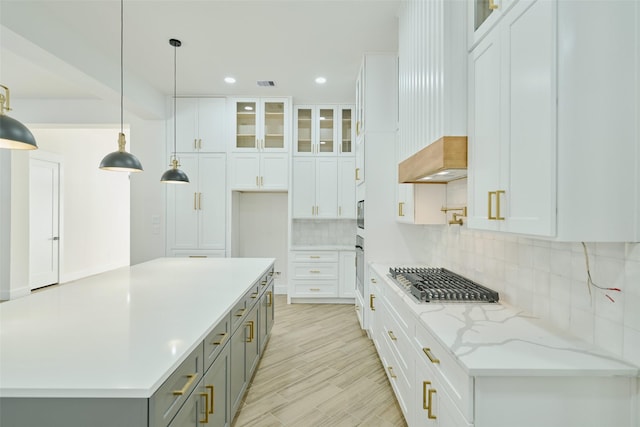 kitchen with gray cabinets, stainless steel appliances, white cabinets, glass insert cabinets, and backsplash