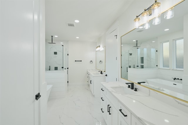 full bath with visible vents, a freestanding tub, marble finish floor, a sink, and a marble finish shower