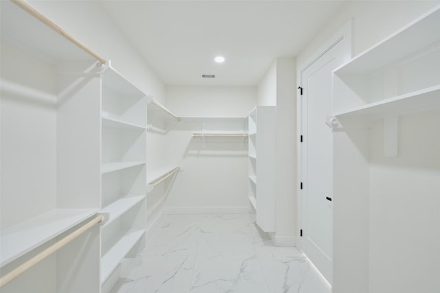 walk in closet featuring visible vents and marble finish floor