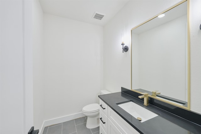 half bath featuring vanity, baseboards, visible vents, tile patterned floors, and toilet