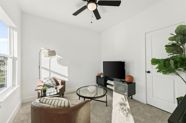 carpeted living room with plenty of natural light and ceiling fan