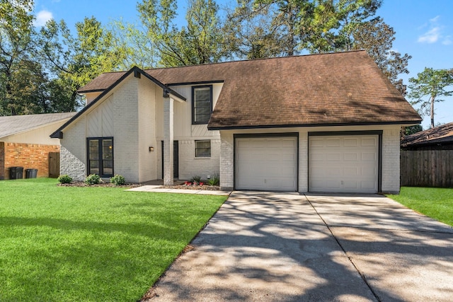 view of front of home with a garage and a front yard