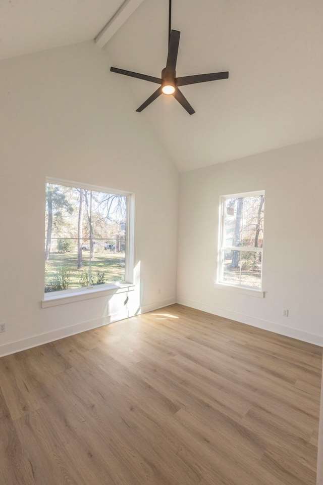 spare room with hardwood / wood-style flooring, ceiling fan, beam ceiling, and high vaulted ceiling