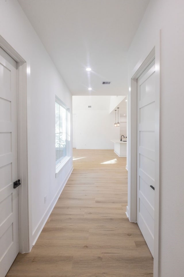 hallway featuring light hardwood / wood-style floors