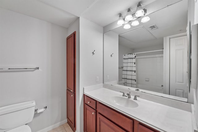 bathroom with vanity, tile patterned floors, and toilet