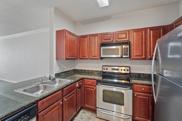 kitchen featuring sink, dark stone counters, and appliances with stainless steel finishes