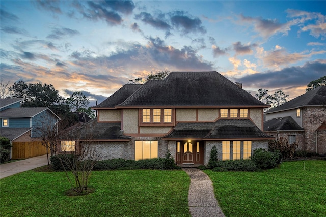 view of front of house with a lawn