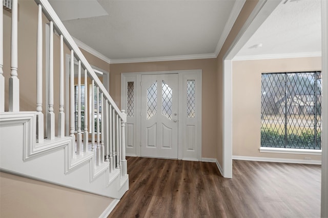 foyer featuring crown molding, plenty of natural light, and dark hardwood / wood-style floors