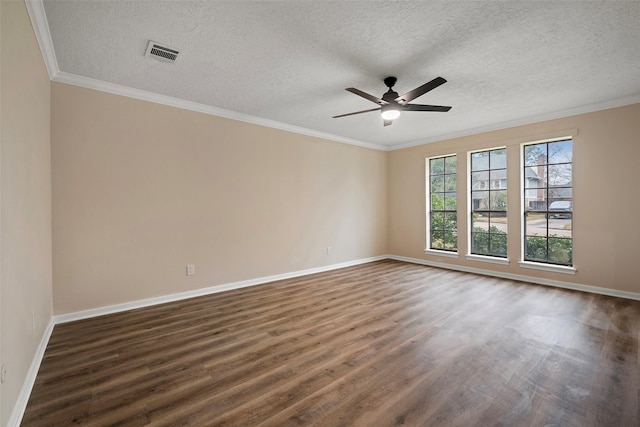 spare room featuring crown molding, dark wood-type flooring, and ceiling fan