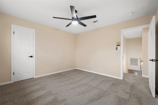 unfurnished room featuring ceiling fan and carpet flooring