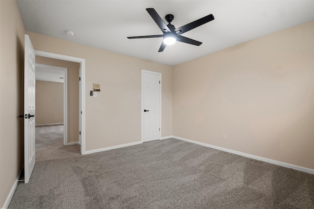 unfurnished bedroom featuring ceiling fan and carpet flooring