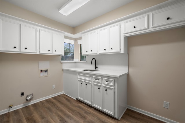 clothes washing area with sink, cabinets, dark hardwood / wood-style floors, washer hookup, and hookup for an electric dryer