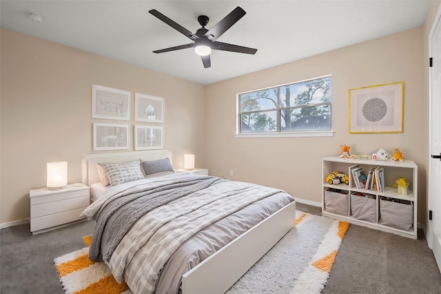 bedroom featuring ceiling fan and carpet