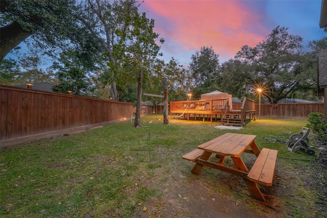 yard at dusk with a deck