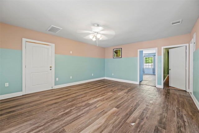 unfurnished room featuring hardwood / wood-style floors and ceiling fan