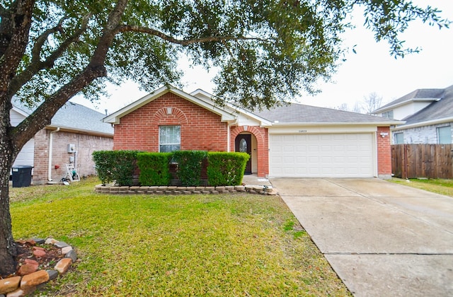 ranch-style home with a garage and a front lawn