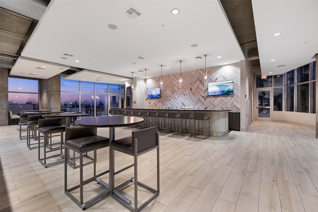 bar featuring pendant lighting