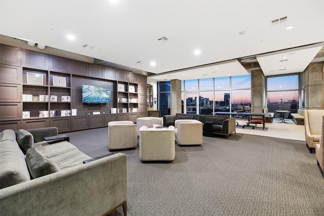 living room featuring floor to ceiling windows, carpet floors, and built in shelves